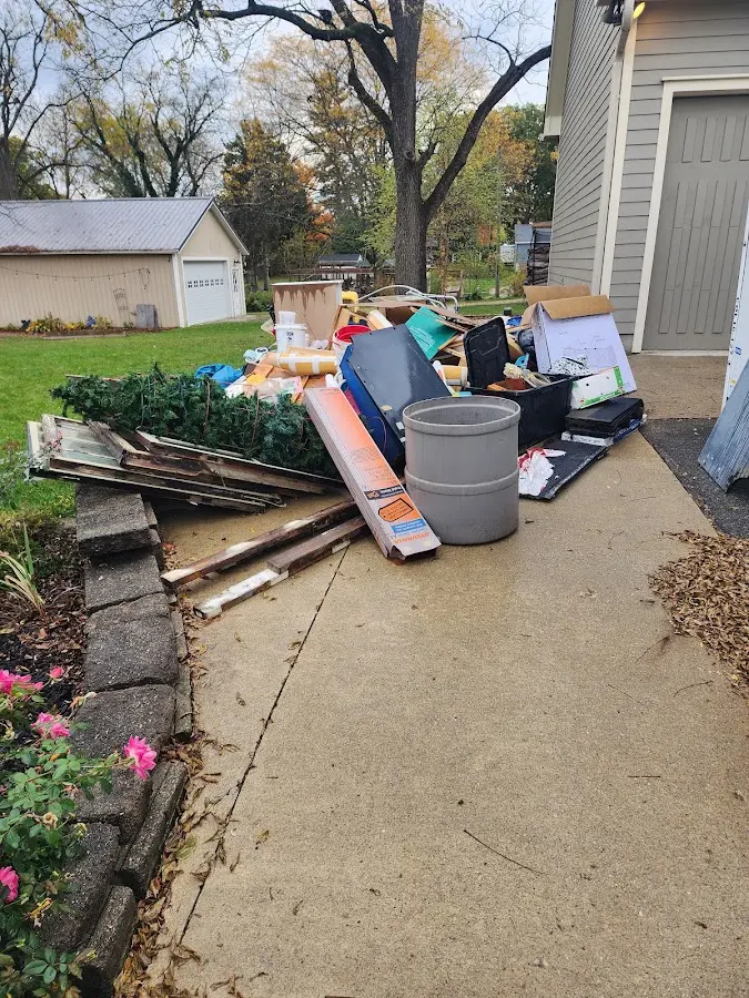 Dumpster being loaded with debris for 10 Yard Dumpster Rental in Jersey City